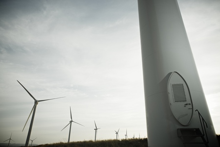Windmills for electric power production at sunset, Pozuelo de Aragon, Zaragoza, Aragon, Spainの写真素材