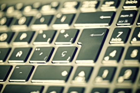 Forefront of a gray laptop keyboard.の写真素材