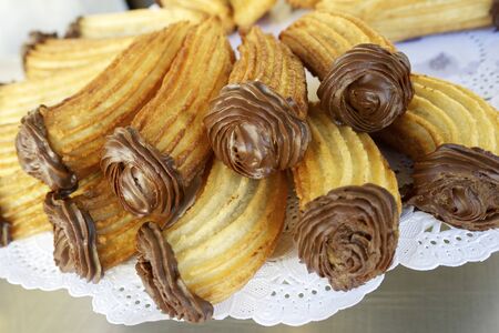 Group of typical churros at a stall, Spain.の写真素材