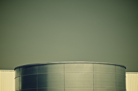 Storage tank with blue and clear skyの写真素材