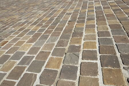 Floor of a street with stone tiles.