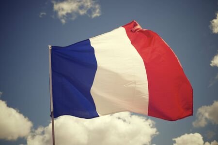 Close-up of the French national flag waving.の写真素材