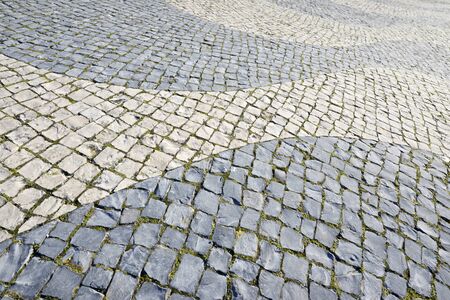 Floor of a street with stone tiles, Lisbon, Portugal.の写真素材