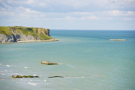 Ruins of harbor built by the Allies in Arromanches, Normandy, France.の写真素材