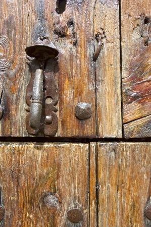 Forefront of the handle of a wooden door.の写真素材