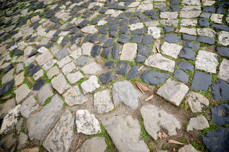 Floor of a street with stone tiles, Lisbon, Portugal.