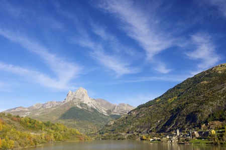 rocky peak near a lake village in the Pyrenees, Lanuza, Huesca, Aragon, Spain.の写真素材