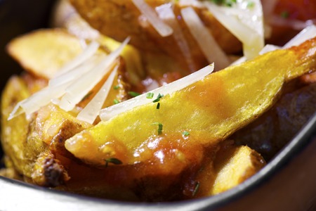 Closeup of some fries with vegetables.
