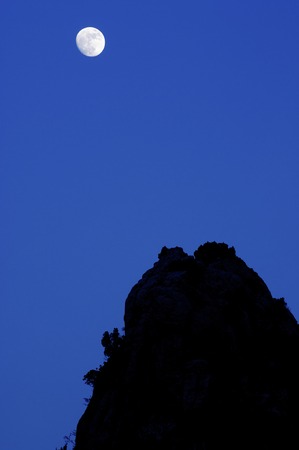 Moon and  rocky pinnacles in  Maestrazgo Mountains, Teruel, Aragon, Spainの写真素材