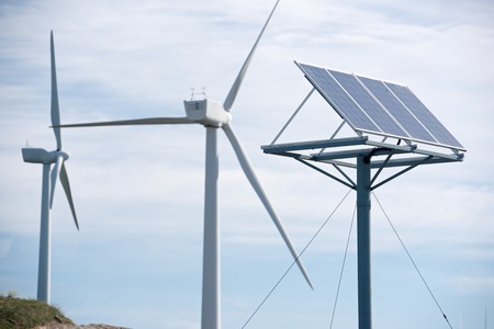 Windmill and photovoltaic panel for energy production, Zaragoza Province, Aragon, Spain.の写真素材