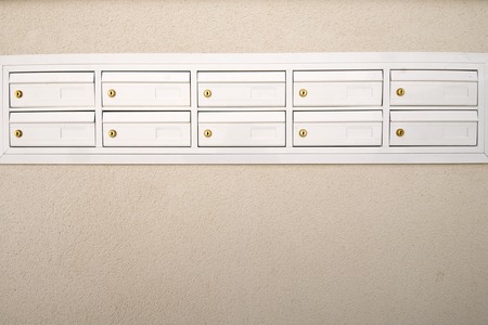 group of white mailboxes in a neighborhood.の写真素材