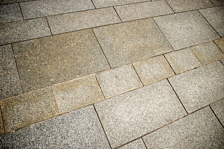 Floor of a street with stone tiles.