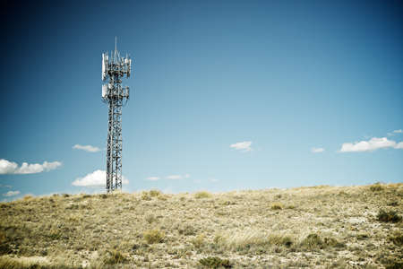 Telecommunications tower with clear blue sky.の写真素材