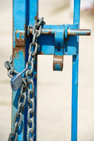 Door closed with a chain and padlock.