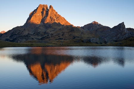 Midi Dossau Peak reflected in Ayous lake. Ossau Valley, Pyrenees National Park, Pyrenees, France.の写真素材