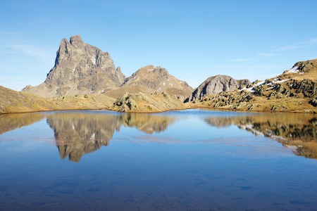 Midi Dossau Peak reflected in a lake. Ossau Valley, Pyrenees National Park, Pyrenees, France.の写真素材
