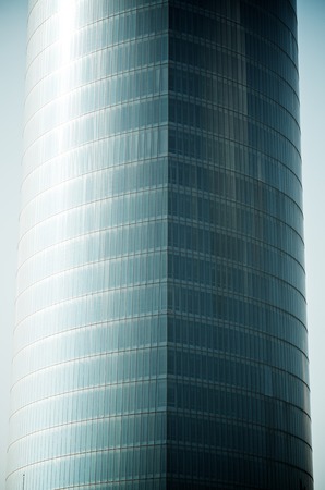 forefront of the glass facade of a skyscraper