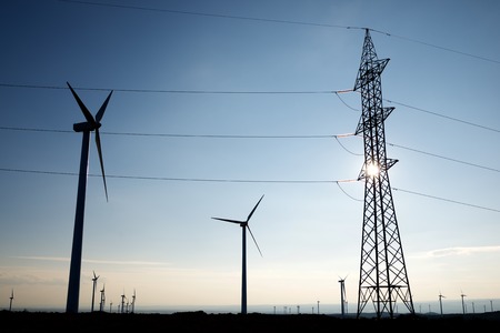 Windmills for electric power production at sunset, Huesca Province, Aragon, Spain