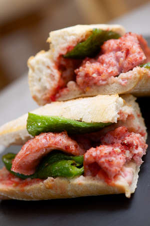 Sausage butty with green pepper and tomato.の写真素材