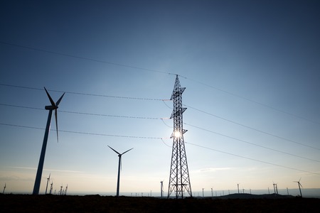 Windmills for electric power production at sunset, Huesca Province, Aragon, Spain