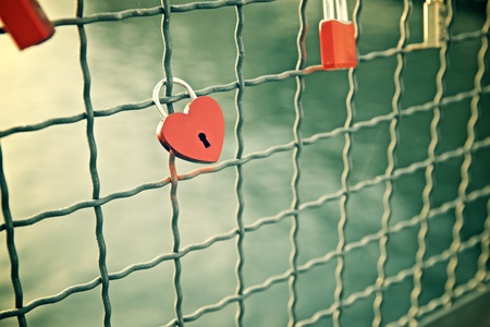 Love padlocks on the railing of a bridge, Berlin, Germany.の写真素材