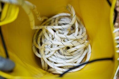 Climbing rope inside a yellow backpack.の写真素材
