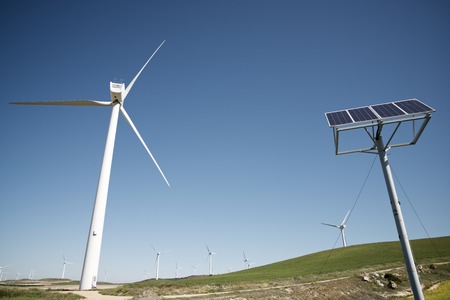 Windmills and photovoltaic panel for energy production, Zaragoza Province, Aragon, Spain.
