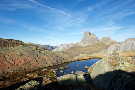 Midi Dossau Peak reflected in a lake. Ossau Valley, Pyrenees National Park, Pyrenees, France.の写真素材