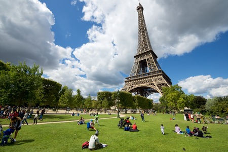 Paris, France - August 21, 2014: Tourists enjoying a beautiful day in the surroundings of the eifel tower.のeditorial素材