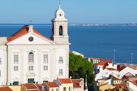 Alfama downtown and Santo Estevao Church in Lisbon, Portugal.の写真素材