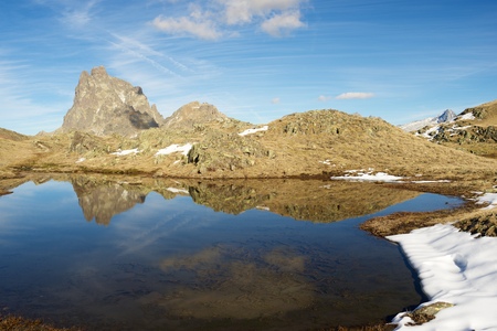 Midi Dossau Peak reflected in a lake. Ossau Valley, Pyrenees National Park, Pyrenees, France.の写真素材