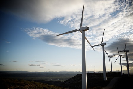 Windmills for electric power production at sunset, Zaragoza Province, Aragon, Spain.