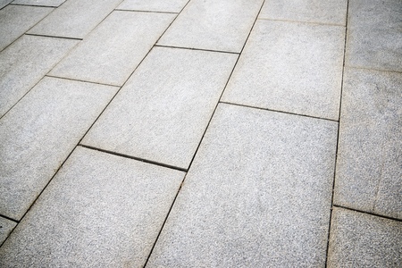 Floor of a street with stone tiles.