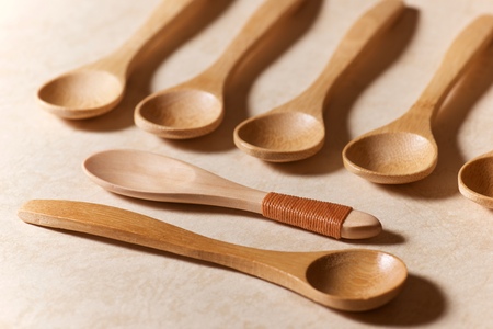 Wooden spoons on a marble table.の写真素材