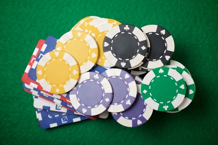 view of a gaming table with green mat
