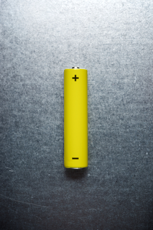 Small battery on a metal table.の写真素材