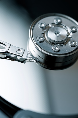 Closeup of an open computer hard drive.
