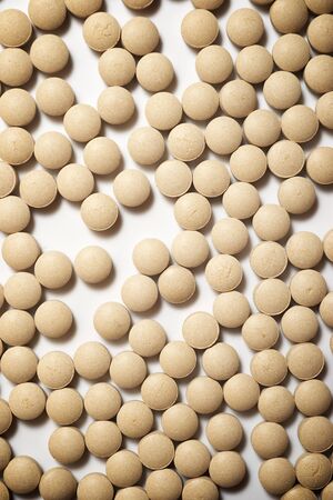 Many beer yeast pills on a table.の写真素材