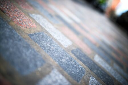 Floor of a street with stone tiles in London, England.