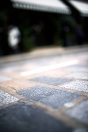 Floor of a street with stone tiles in London, England.の写真素材