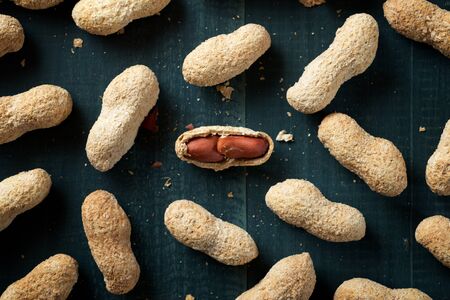 Peanuts with shell on a table.