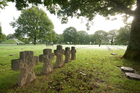 La Cambe, France - August 8, 2014: Aligned tombs in German Military Cemetery.