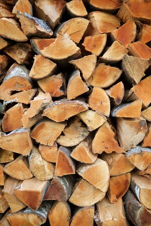 Background created with stacked firewood.の写真素材