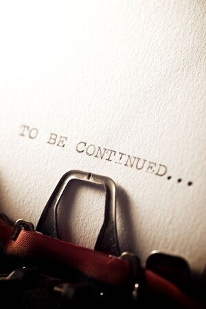 The sentence, to be continued, written with a typewriter.の写真素材