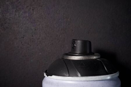 Used can of spray painting and black backgroundの写真素材