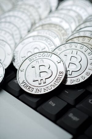 Bitcoins on a keyboard computer.の写真素材