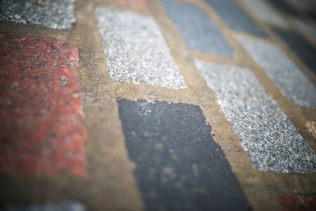Floor of a street with stone tiles in London, England.