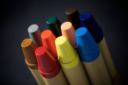 Group of wax crayons on a table.
