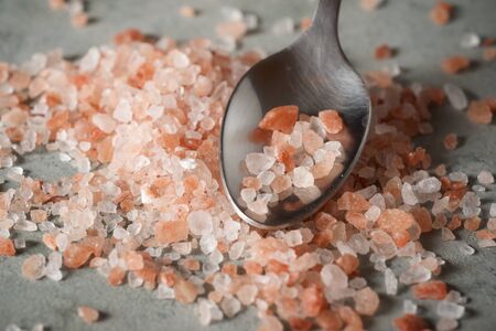 Himalayan salt on a spoon.の写真素材