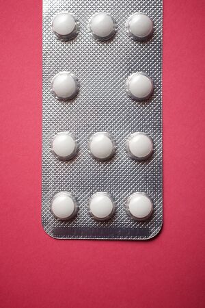 View of a white medicine pills in blister pack.